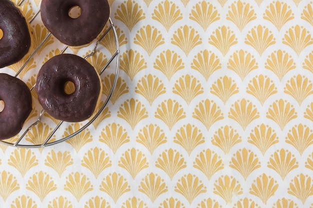 pattern,food,birthday,party,circle,cake,bakery,wallpaper,chocolate,color,celebration,metal,shape,yellow,golden,breakfast,round,sweet,birthday cake,decorative,dessert,celebrate,brown,stand,birthday party,donut,cloth,cream,steel,sugar,fresh,snack,circle pattern,textile,food pattern,donuts,delicious,angle,rack,doughnut,high,chocolates,tasty,calories,baked,arrangement,treat,repetition,arrange,unhealthy,overhead,elevated