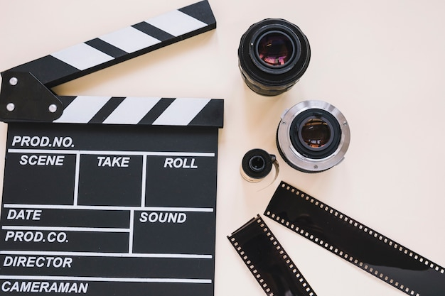 Free: Clapperboard, camera lenses and film reels 