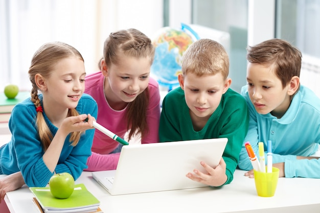 school,people,technology,children,computer,education,student,laptop,happy,kid,child,study,team,person,white,modern,data,information,classroom,group