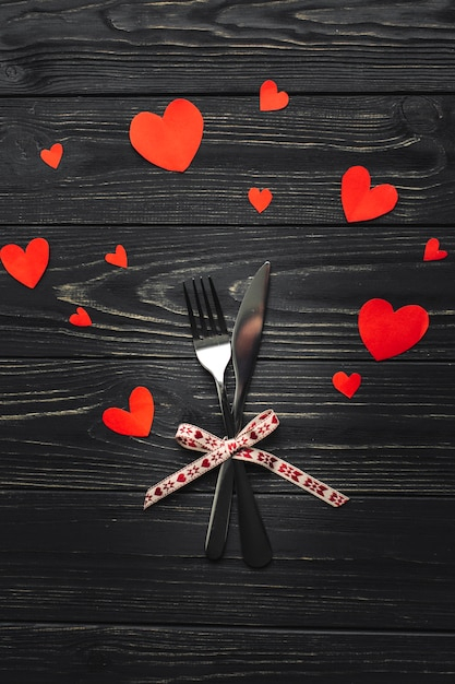 background,ribbon,love,restaurant,paper,table,red,red background,valentines day,valentine,bow,metal,decoration,service,dinner,fork,symbol,red ribbon,hearts,studio