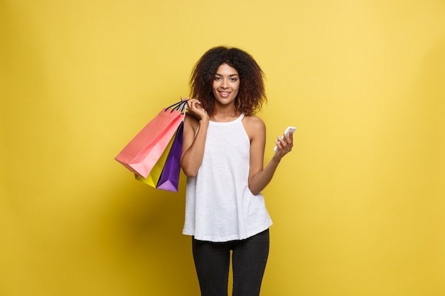 background,people,fashion,shopping,black background,space,smile,black,happy,white background,wall,colorful,bag,person,yellow,white,shopping bag,pastel,customer,fashion girl
