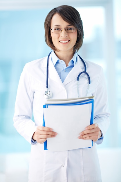 people,paper,medical,doctor,health,hospital,person,medicine,job,success,document,employee,nurse,healthcare,female,young,stethoscope,uniform,professional,documents