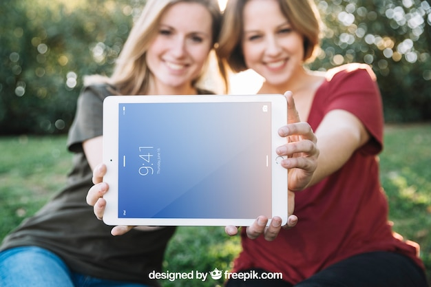 mockup,technology,template,nature,friends,mock up,tablet,modern,picnic,friendship,display,screen,female,gadget,device,up,outdoors,mock