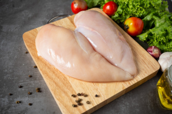 Raw Chicken Breast On A Wooden Cutting Board Stock Photo, Picture and  Royalty Free Image. Image 27433651.