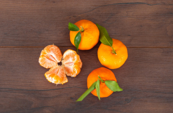 Fresh Mandarin Oranges Fruit With Leaves On Wooden Table. Stock Photo,  Picture and Royalty Free Image. Image 91454014.