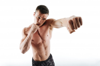 A close up image of the chest and arm of a young man flexing his biceps and  chest, Stock Photo, Picture And Low Budget Royalty Free Image. Pic.  ESY-055053978