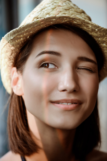 young girl, dark-skinned girl, smiling girl, brunette girl, hat with a wide  brim, black hat