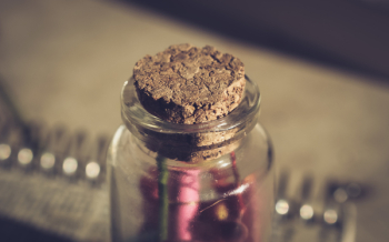Brown Mason Jar Mug With Straw Beside Plant on Table · Free Stock