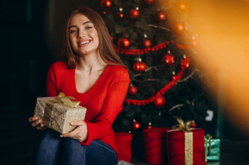 Premium Photo  Young mom with kids holding christmas presents