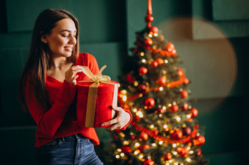 Premium Photo  Young mom with kids holding christmas presents