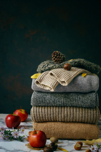 Cozy winter morning at home. Hot tea with lemon, knitted sweaters