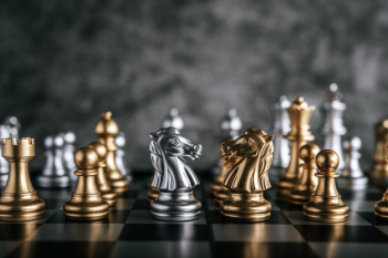 Free Photo  Gold and silver chess on chess board game for business  metaphor leadership concept