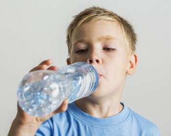 Close Up Photo Of A Thirsty Teen Boy Drinking Fresh Water From Plastic  Bottle Outdoors Sunny Day. Stock Photo, Picture and Royalty Free Image.  Image 48779037.