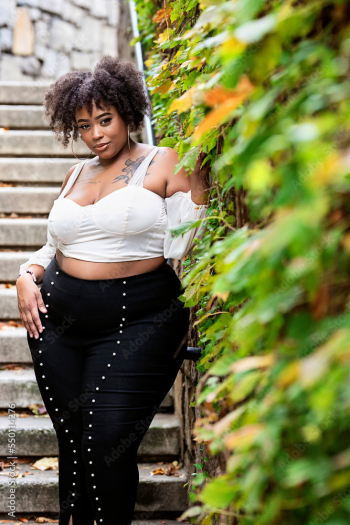 Free: Plus size fashion forward Black woman outside 