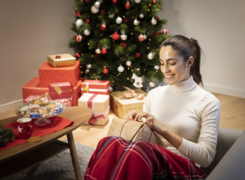 Premium Photo  Young mom with kids holding christmas presents