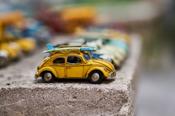 blur,cars,classic,close-up,color,concept,concrete,miniature,model,outdoors,small,street,toy cars,toys,travel,vintage,vw beetle,wheel