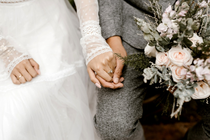 bouquet,bride,bride and groom,couple,flowers,groom,hands,holding hands,man,marriage,romance,romantic,togetherness,wedding,woman