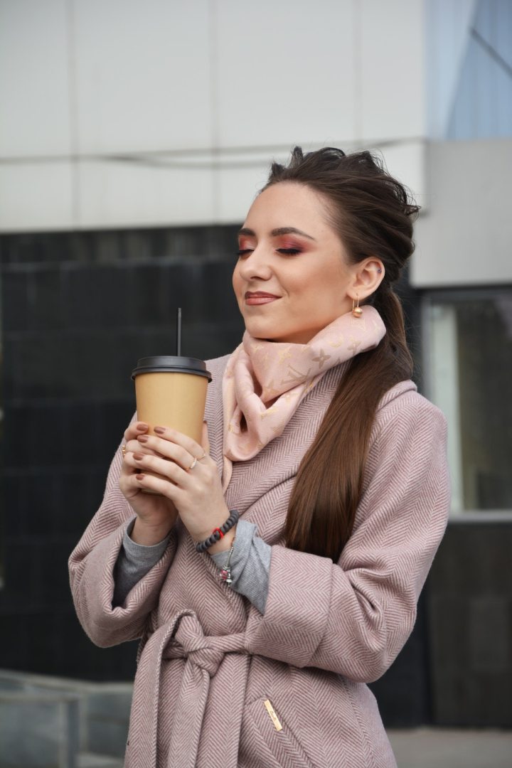 beautiful woman,beverage,brunette,coffee to go,drink,enjoyment,eye makeup,eyes closed,facial expression,happy,holding,make up,outerwear,photoshoot,posing,pretty,smiling,standing,woman