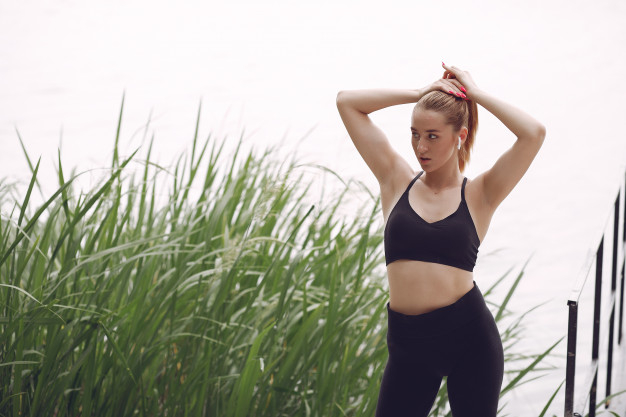 Free: Beautiful sports girl in a summer park Free Photo 