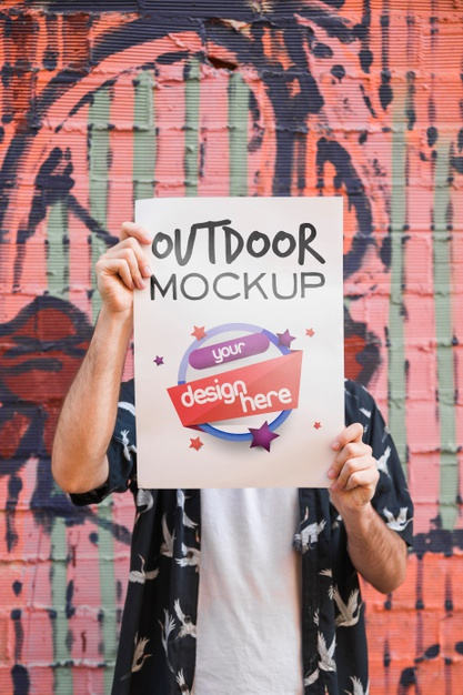 presenting,outside,mock,front,showroom,showcase,guy,up,lifestyle,young,outdoor,urban,brick wall,graffiti,brick,mock up,person,board,wall,man,template,city,cover,mockup,poster,flyer