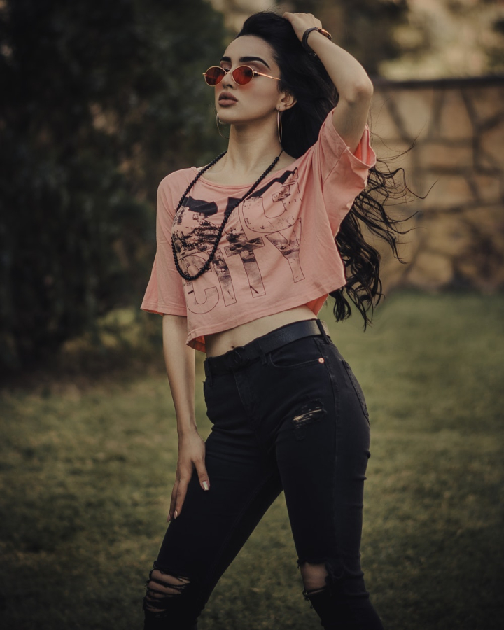 Free Photo | Glad lady in casual jeans outfit standing in confident pose  during photoshoot