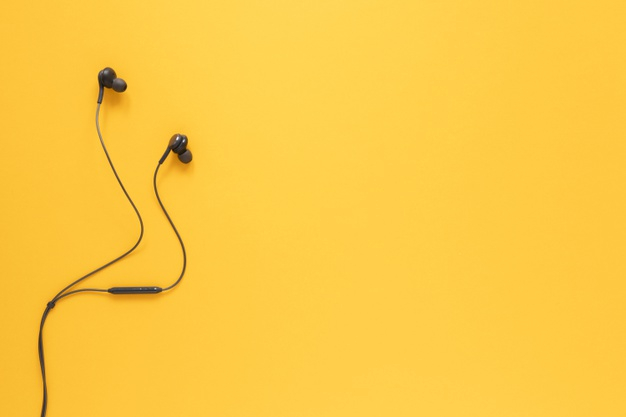 copy space,earbuds,lay,portable,stereo,copy,flat lay,headset,musical,top view,top,entertainment,audio,view,headphones,sound,modern,flat,yellow background,yellow,space,technology,music,background