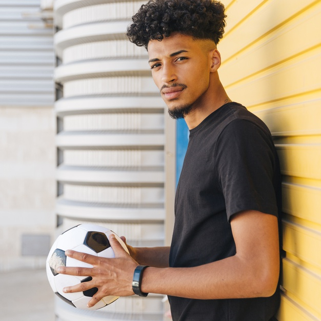 square format,looking at camera,copy space,concentrated,side view,sport clothes,relaxed,black hair,serious,format,sporty,side,thin,african american,outdoors,crop,looking,copy,active,holding,slim,player,male,american,fit,teen,view,young,african,stand,gray,teenager,ball,healthy,beard,person,yellow,game,square,clothes,black,space,soccer,student,football,hair,sport,man,camera