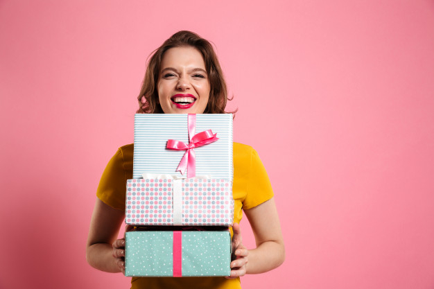 overjoyed,toothy,caucasian,heap,charming,bunch,brunette,attractive,cheerful,casual,stack,pretty,laughing,adult,holding,arms,laugh,positive,bright,presents,young,female,surprise,lady,lips,dress,makeup,happy,hands,girl,box,fashion,woman,gift,ribbon
