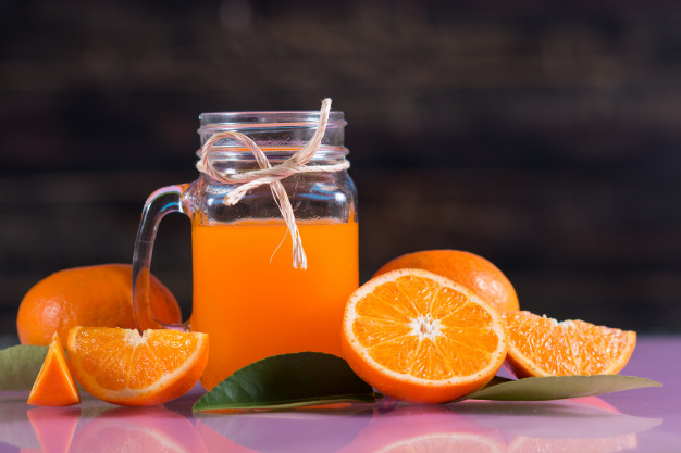 Orange juice in glass jug as organic squeezed Vector Image