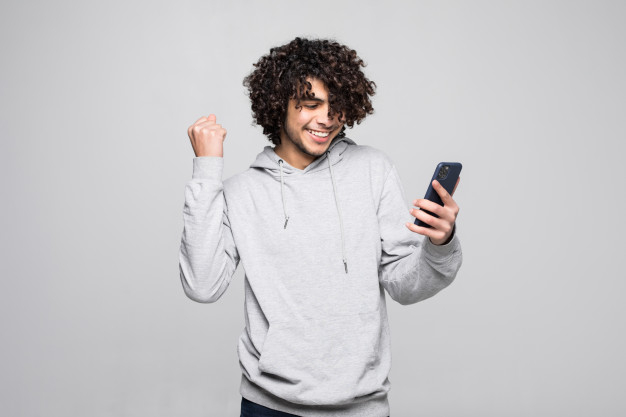 fisted,amused,enjoying,middle,trouser,posing,brazilian,outfit,east,confident,eastern,casual,excited,latin,standing,looking,playing,typing,egyptian,curly,arabian,positive,teen,happiness,arab,jacket,young,african,classic,egypt,open,fun,mouth,tablet,smartphone,game,shirt,mobile,hands,man,phone,fashion,technology