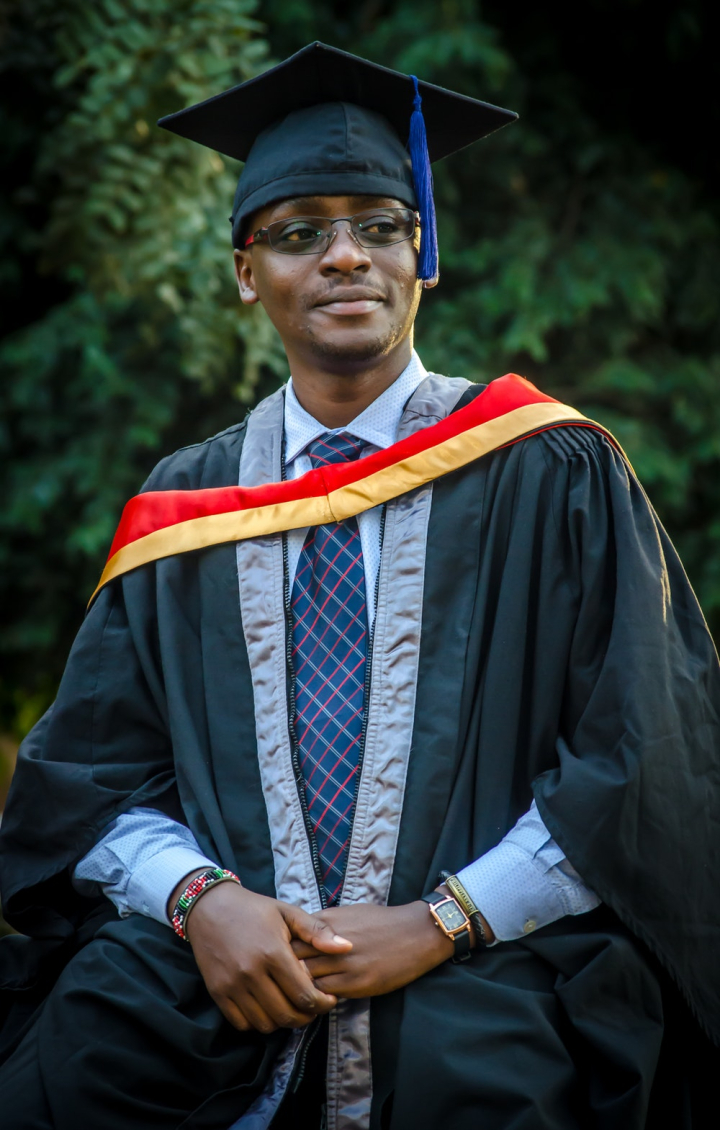 A man wearing a graduation cap and gown photo – Free Graduation Image on  Unsplash
