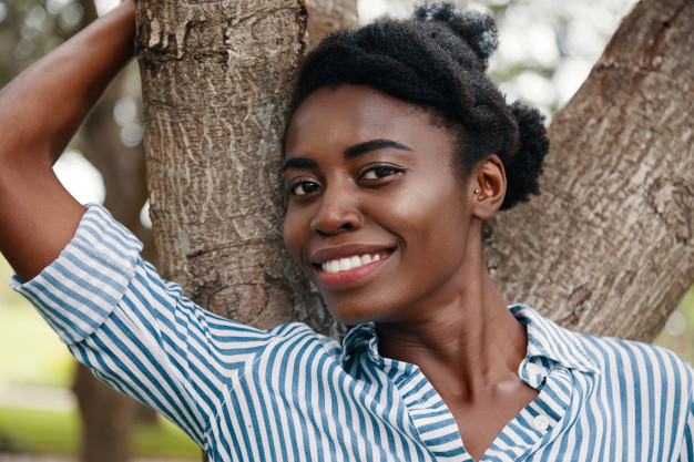 afroamerican,closeup,stunning,white teeth,posing,attractive,cheerful,african american,smiling,afro,american,teen,portrait,beautiful,young,outdoor,african,lady,model,teeth,white,girl,woman,tree