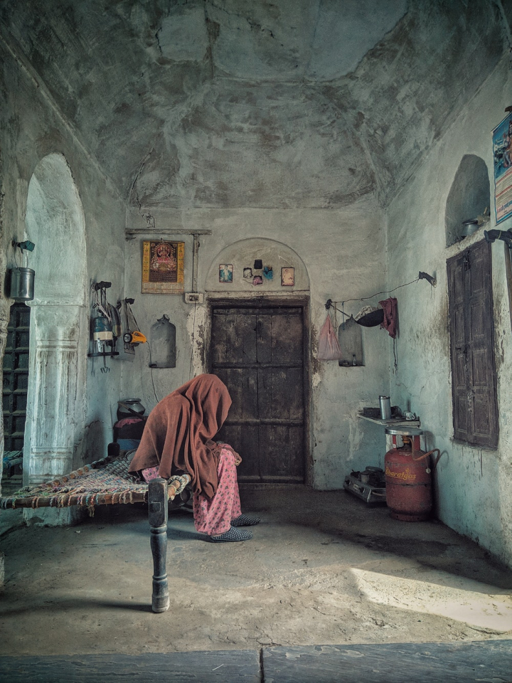 arches,architecture,bed,culture,door,elderly,furniture,headscarf,home,home interior,indoors,inside,interior,interior design,mammal,old lady,old person,person,position,room,wear,woman