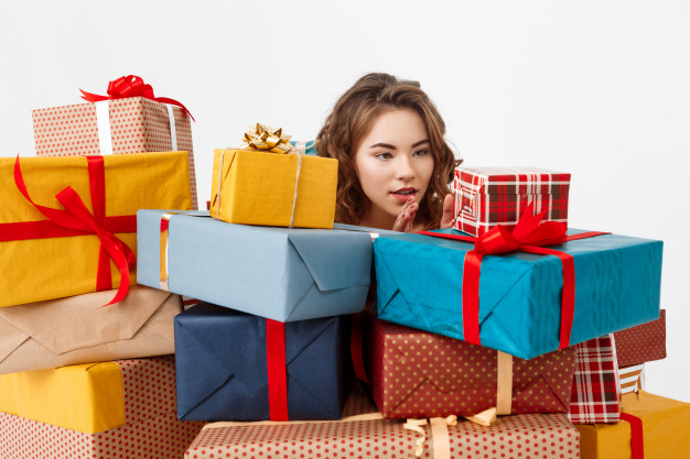 wishlist,cheerful,casual,colored,surprised,curly,boxes,young,jeans,surprise,present,box,woman,gift,party,ribbon,christmas