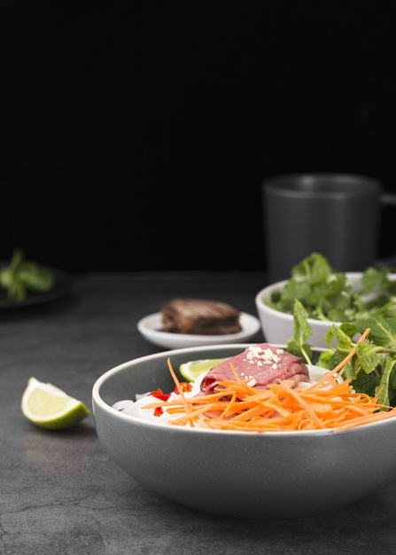front view,copy space,lime slice,nutrients,nutritional,slice,raw,vietnamese,carrots,tasty,front,copy,ham,lime,mint,noodles,view,vietnam,fresh,bowl,nutrition,traditional,diet,cup,space,food