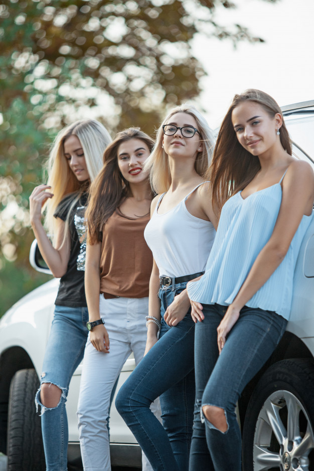 carefree,cheerful,outdoors,pretty,adult,automobile,joy,drive,portrait,beautiful,vehicle,driver,young,together,freedom,friend,friendship,auto,open,sunglasses,adventure,person,happy,smile,cute,road,people,car