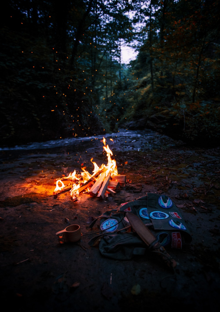 ash,backpack,blaze,bonfire,burn,burning,burnt,camp,camping,close-up,coal,cup,dark,embers,fire,firewood,flame,forest,heat,hot,river,smoke,trees,warmly
