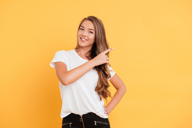 caucasian,charming,posing,brunette,attractive,confident,cheerful,casual,excited,standing,looking,pointing,pretty,adult,arms,gesture,positive,arm,portrait,young,lady,finger,happy,cute,beauty,hair,hands,girl,camera,woman,hand