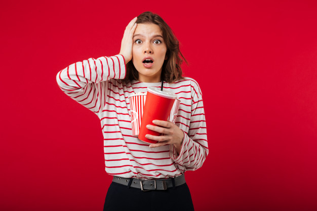 astonished,caucasian,joyful,pleasure,shocked,attractive,cheerful,casual,humor,leisure,looking,pretty,surprised,adult,audience,soda,plastic,entertainment,pop,young,theatre,eating,female,youth,popcorn,funny,fun,teenager,cup,drink,movie,film,cinema,happy,woman,food