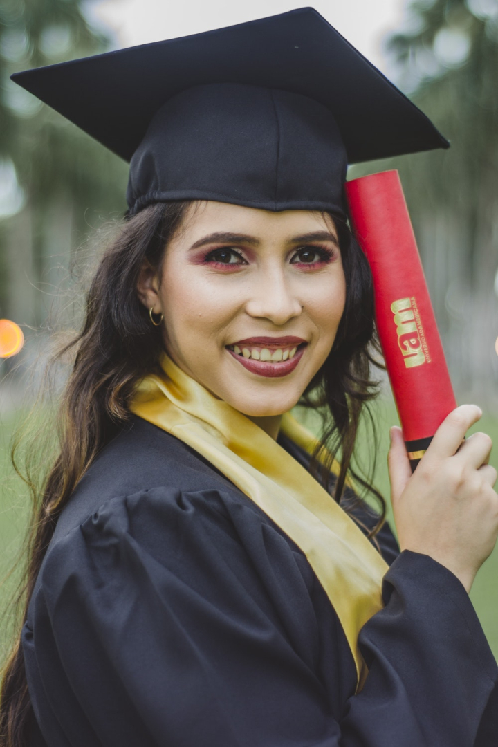 Free: Selective Focus Portrait Photo of Smiling Woman in Black Academic ...