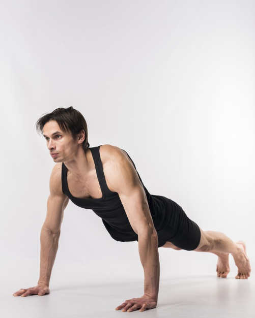 Athlete guy stands in plank pose does push up exercise outdoor breathes  fresh air has strong body Stock Photo by StudioVK