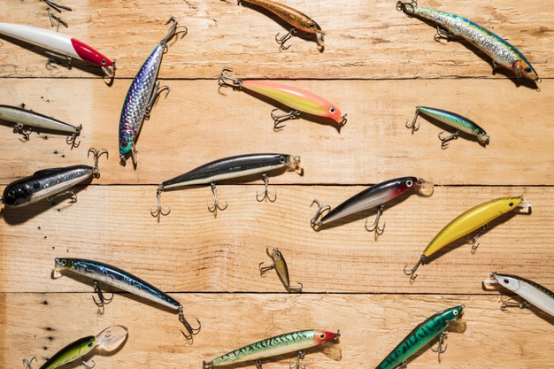 Free: Colorful fishing lures on wooden desk Free Photo 