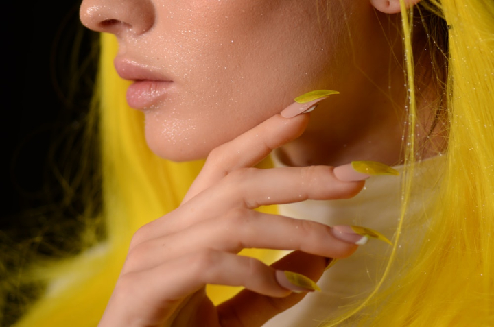 close-up,fingers,glitter,hand,lips,nails,nose,photoshoot,posing,woman,yellow,yellow hair