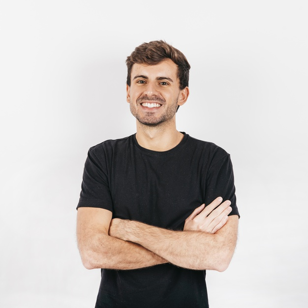 square format,looking at camera,copy space,casual clothes,shaved,pleasant,arms crossed,crossed,fashionable,charming,black shirt,format,cheerful,casual,handsome,white wall,standing,looking,copy,smiling,stylish,guy,arms,male,positive,portrait,hairstyle,young,studio,person,white,square,clothes,shirt,wall,happy,white background,black,space,hands,man,camera,background