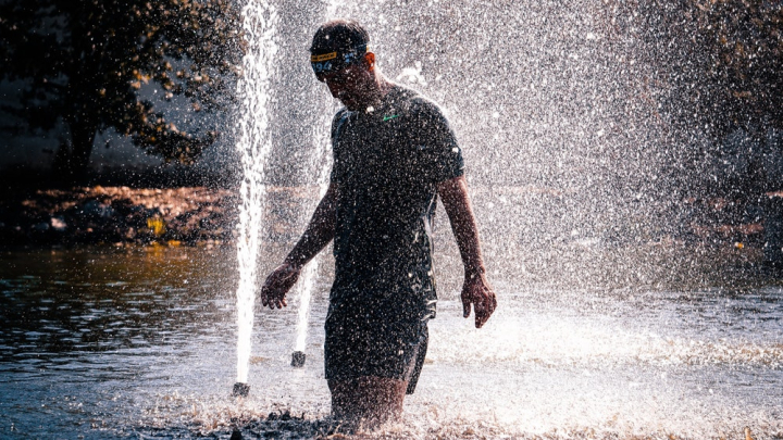 action,action energy,athlete,daylight,fountain,fun,male,man,outdoors,person,recreation,splash,spray,water,wet