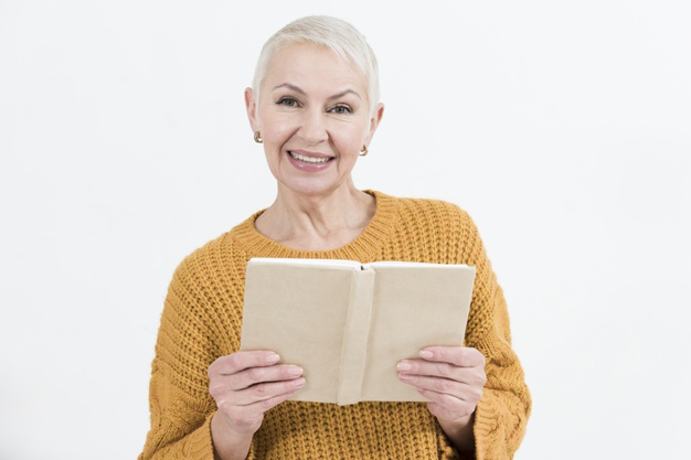 Young Casual Guy Holding Book And Looking To Side, Standing On Pink  Background Stock Photo, Picture and Royalty Free Image. Image 140832256.