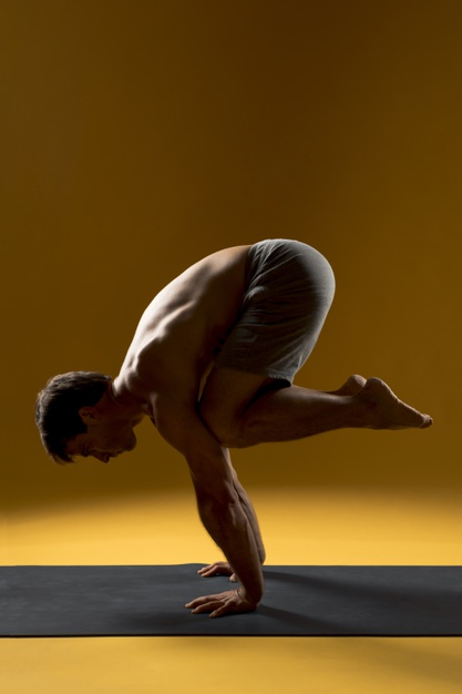 Free: Man practicing balance yoga pose Free Photo 