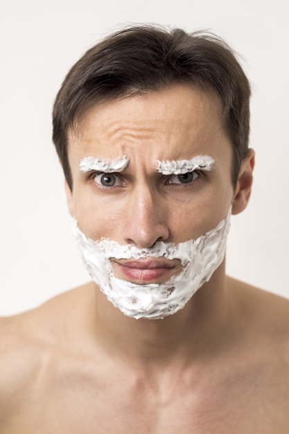 man care,looking at camera,frowning,shirtless,shaving cream,shaving foam,forehead,topless,brunette,close up,young adult,shaving,looking,hygiene,adult,guy,close,foam,male,up,lifestyle,portrait,skin care,young,cream,care,skin,funny,face,man,camera