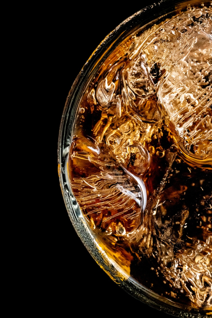 alcoholic beverage,alcoholic drink,beverage,black background,carbonated,close-up,coca-cola,cold,drink,glass,ice,icy,liquid,liquor,refreshment