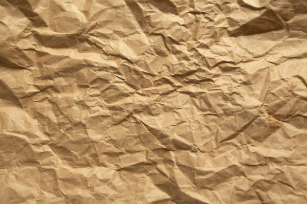 Detail of creased and wrinkled orange paper - Stock Image - F025